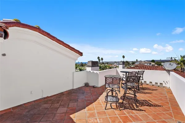 an aerial view of a house with beach and outdoor space