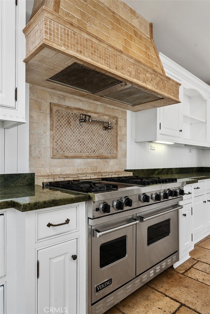 26509 Via Sacramento Dana Point, CA 92624 - Photo 8 of 52 a stove top oven sitting inside of a kitchen