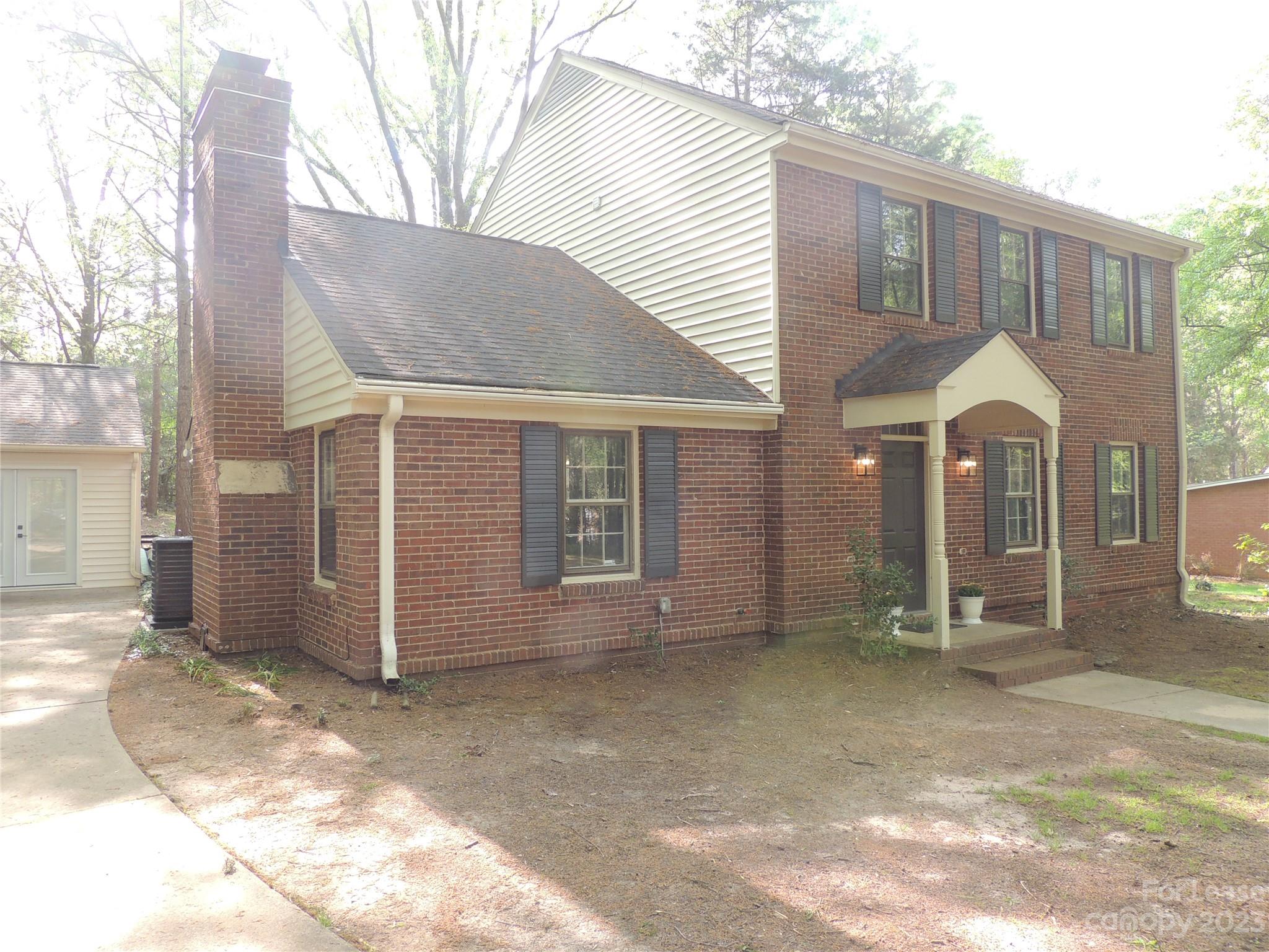 8700 Houston Ridge Road Charlotte, NC 28277 - Photo 2 of 29 a front view of a house with garden