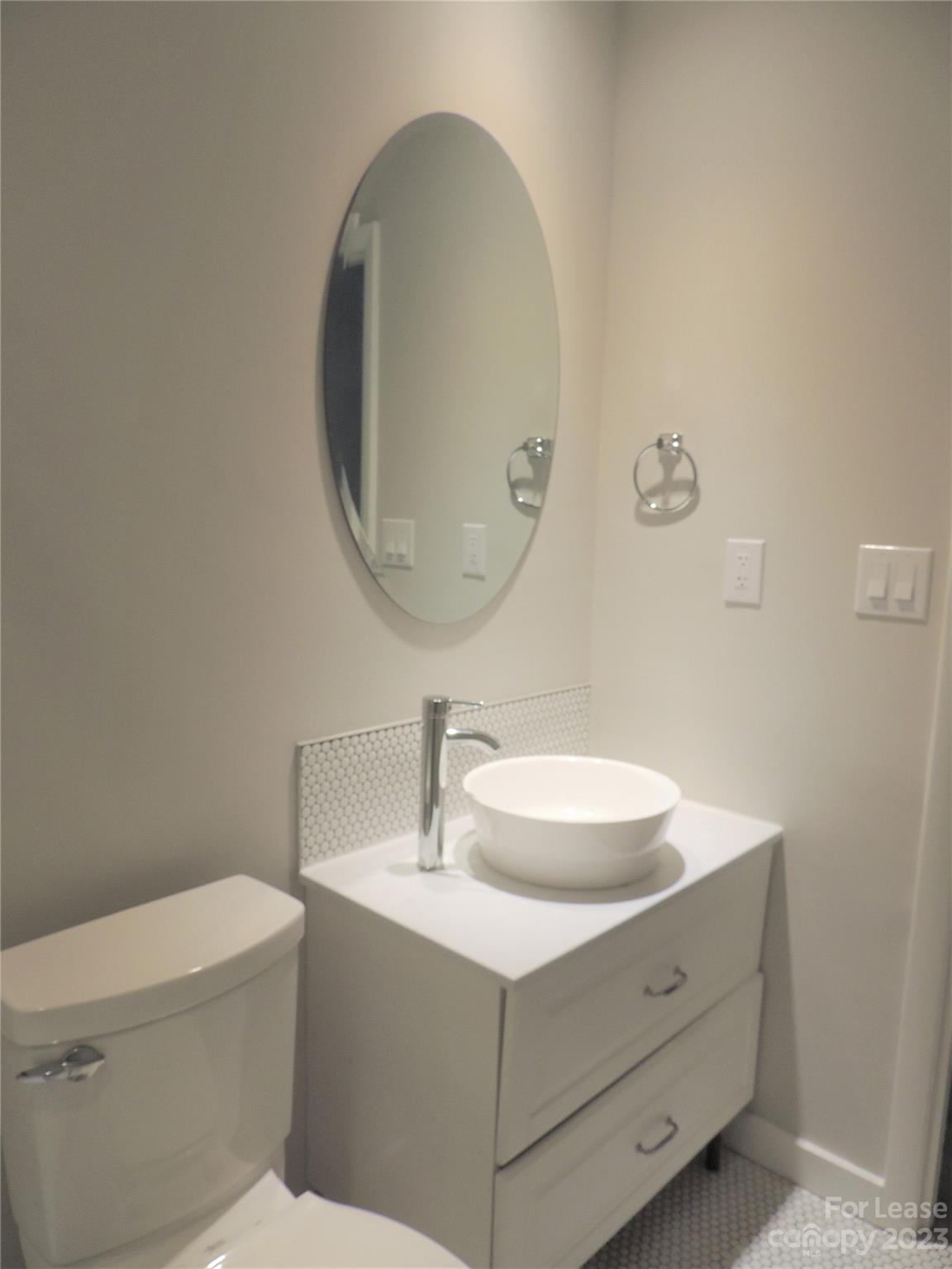 8700 Houston Ridge Road Charlotte, NC 28277 - Photo 22 of 29 a bathroom with a sink mirror vanity and toilet