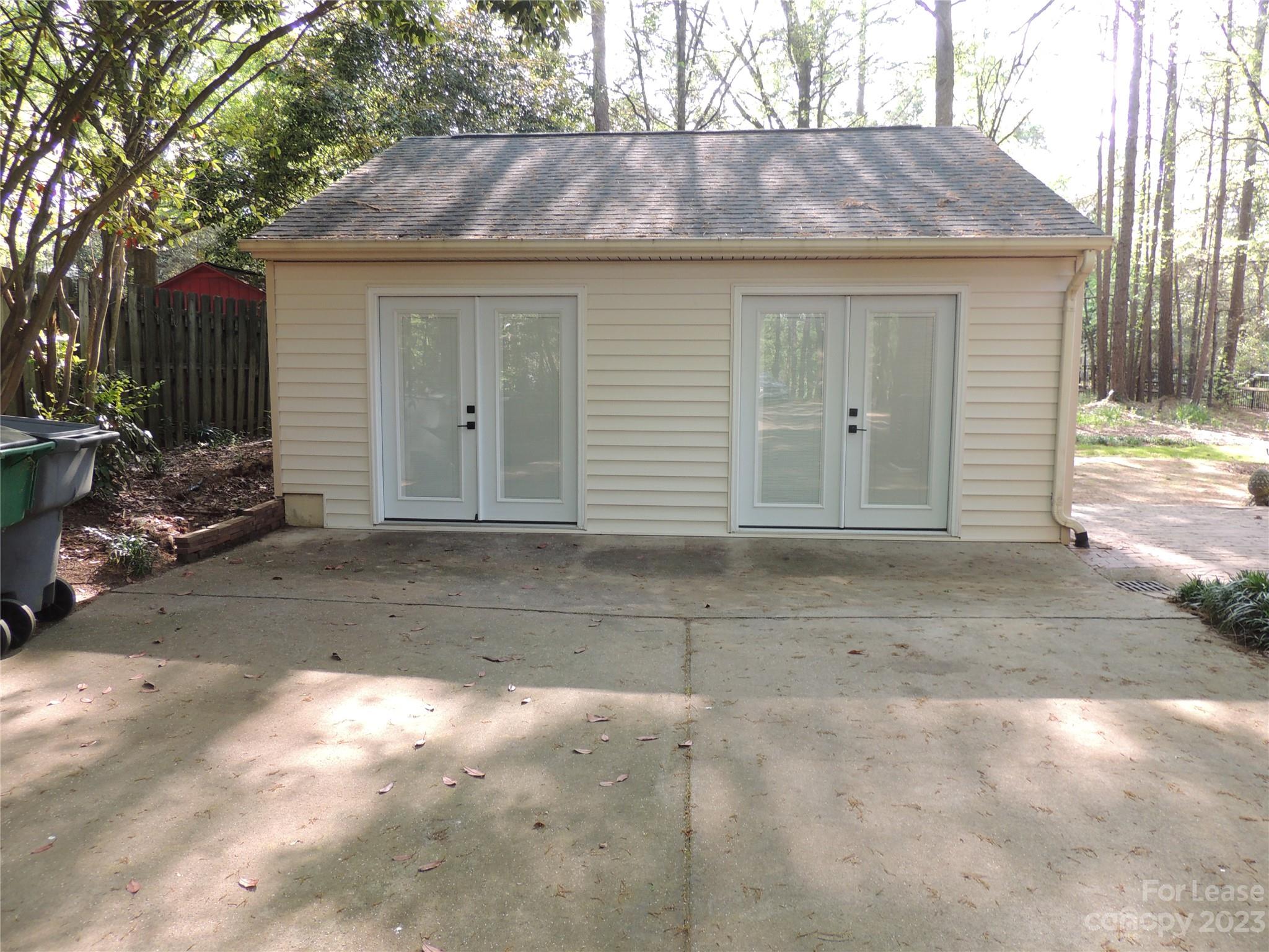 8700 Houston Ridge Road Charlotte, NC 28277 - Photo 24 of 29 a front view of a house with a yard and garage