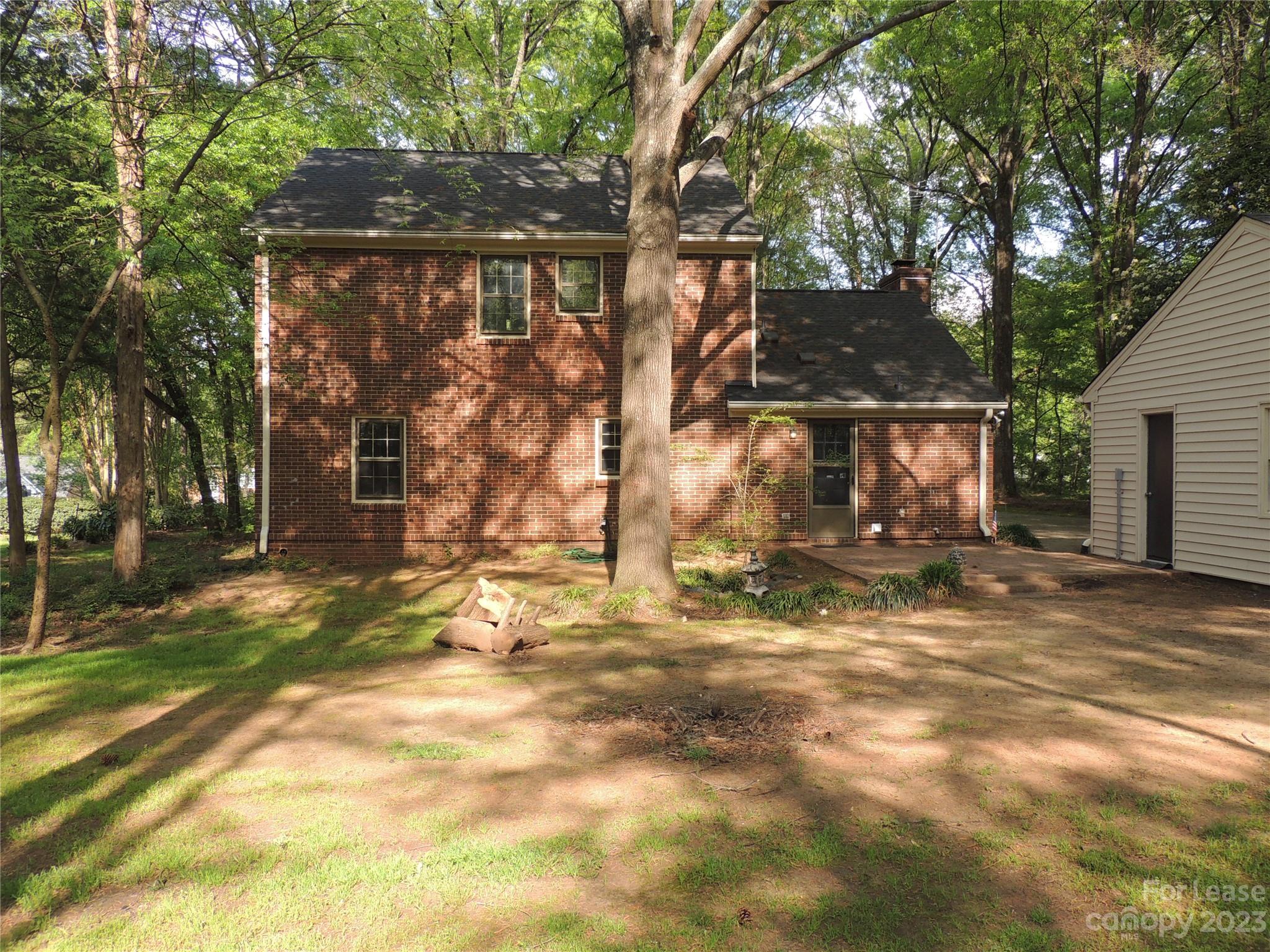 8700 Houston Ridge Road Charlotte, NC 28277 - Photo 26 of 29 a view of a house with a yard