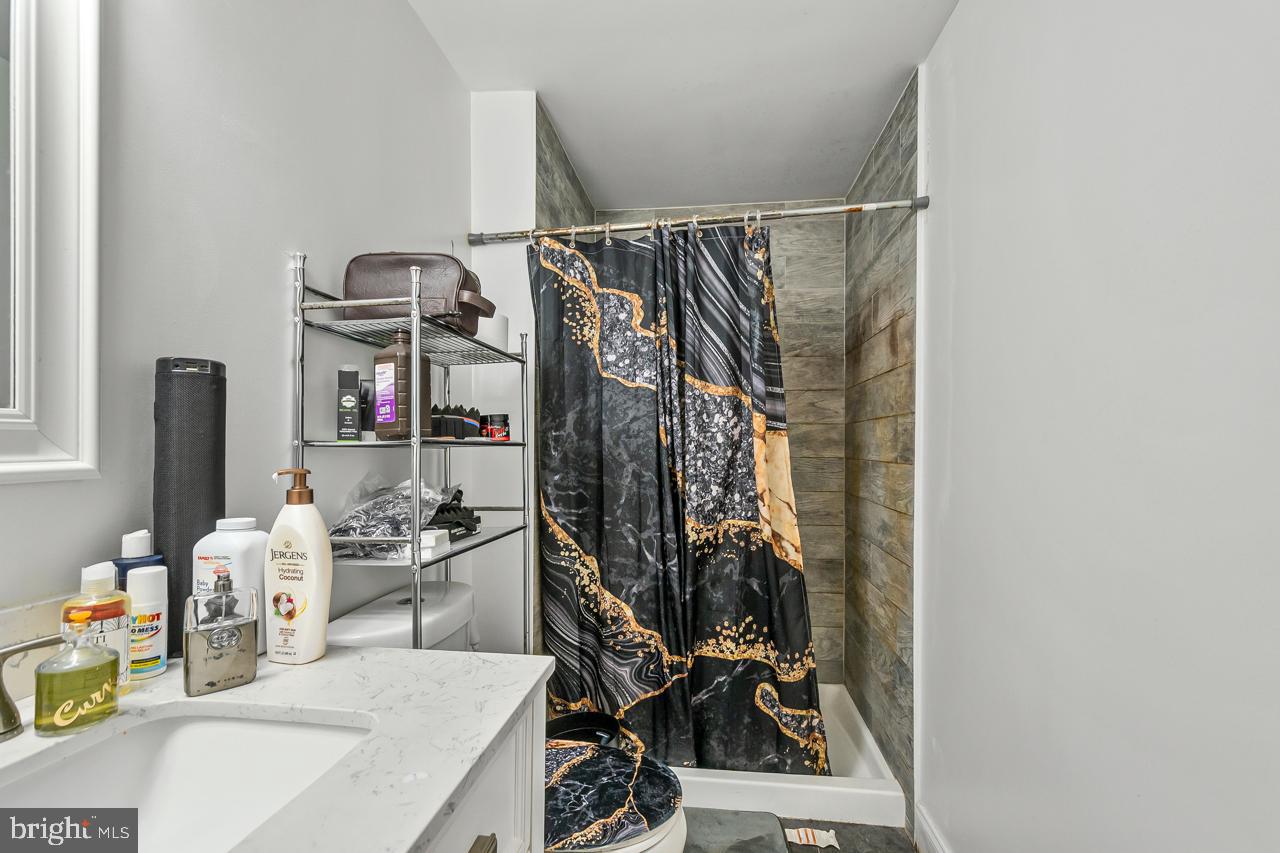 7002 Killarney Street Clinton, MD 20735 - Photo 17 of 26 a view of walk in closet with clothes and shoes