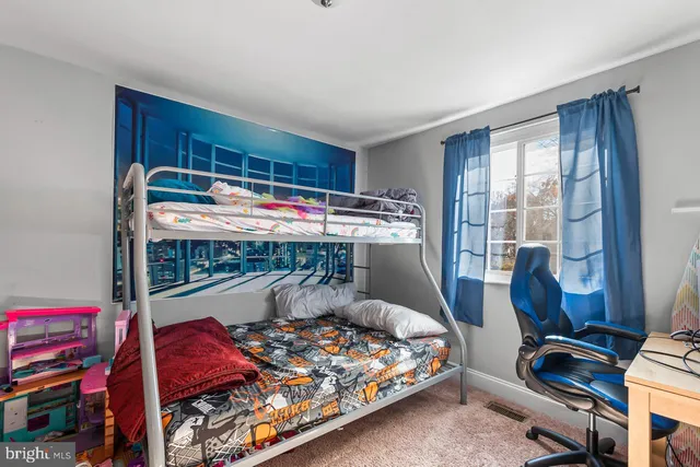 a bed room with a bed and a window