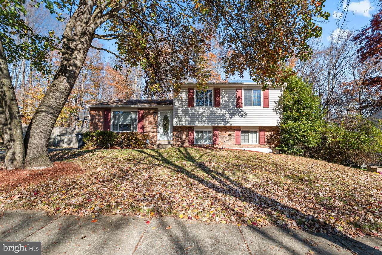 7002 Killarney Street Clinton, MD 20735 - Photo 2 of 26 a front view of a house with a yard