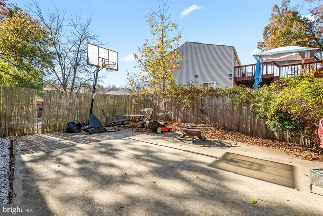 a view of a house with street and trees