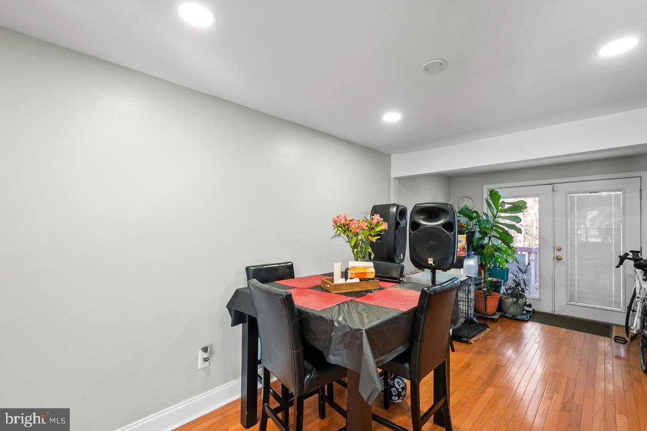 7002 Killarney Street Clinton, MD 20735 - Photo 8 of 26 a view of a dining room with furniture and wooden floor
