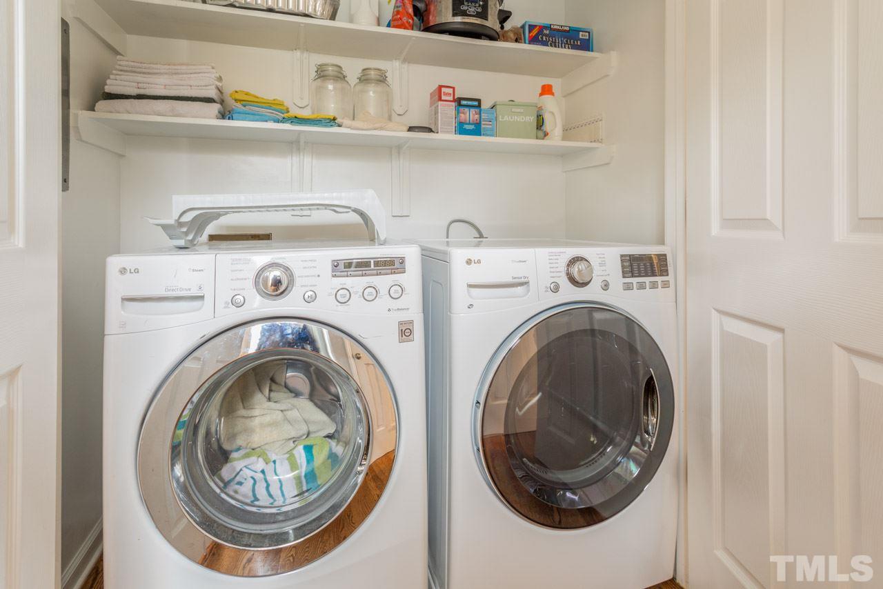 6108 Ivy Ridge Road Raleigh, NC 27612 - Photo 13 of 23 a utility room with dryer and washer