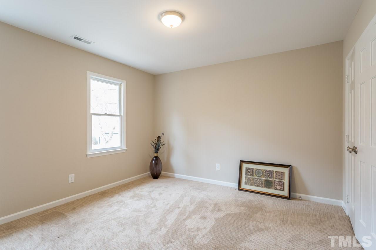 6108 Ivy Ridge Road Raleigh, NC 27612 - Photo 17 of 23 an empty room with windows