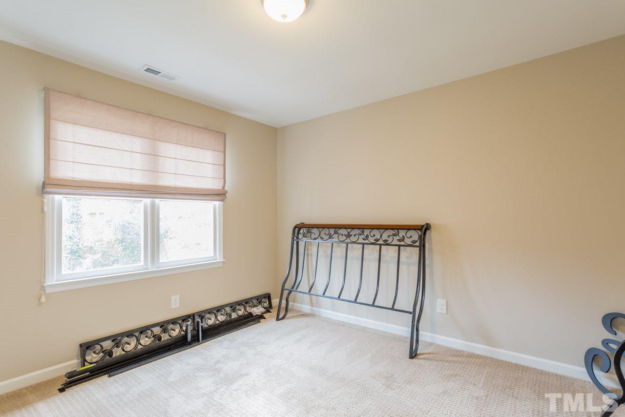 6108 Ivy Ridge Road Raleigh, NC 27612 - Photo 19 of 23 a view of an empty room with a window