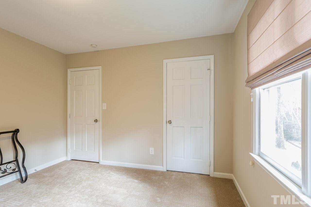 6108 Ivy Ridge Road Raleigh, NC 27612 - Photo 20 of 23 a view of an empty room with a window