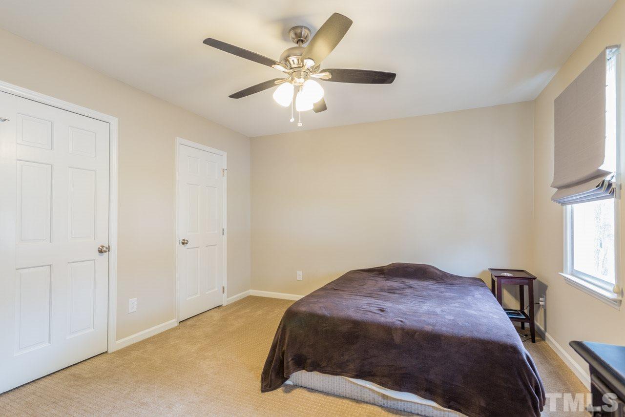 6108 Ivy Ridge Road Raleigh, NC 27612 - Photo 22 of 23 a bedroom with a bed and window