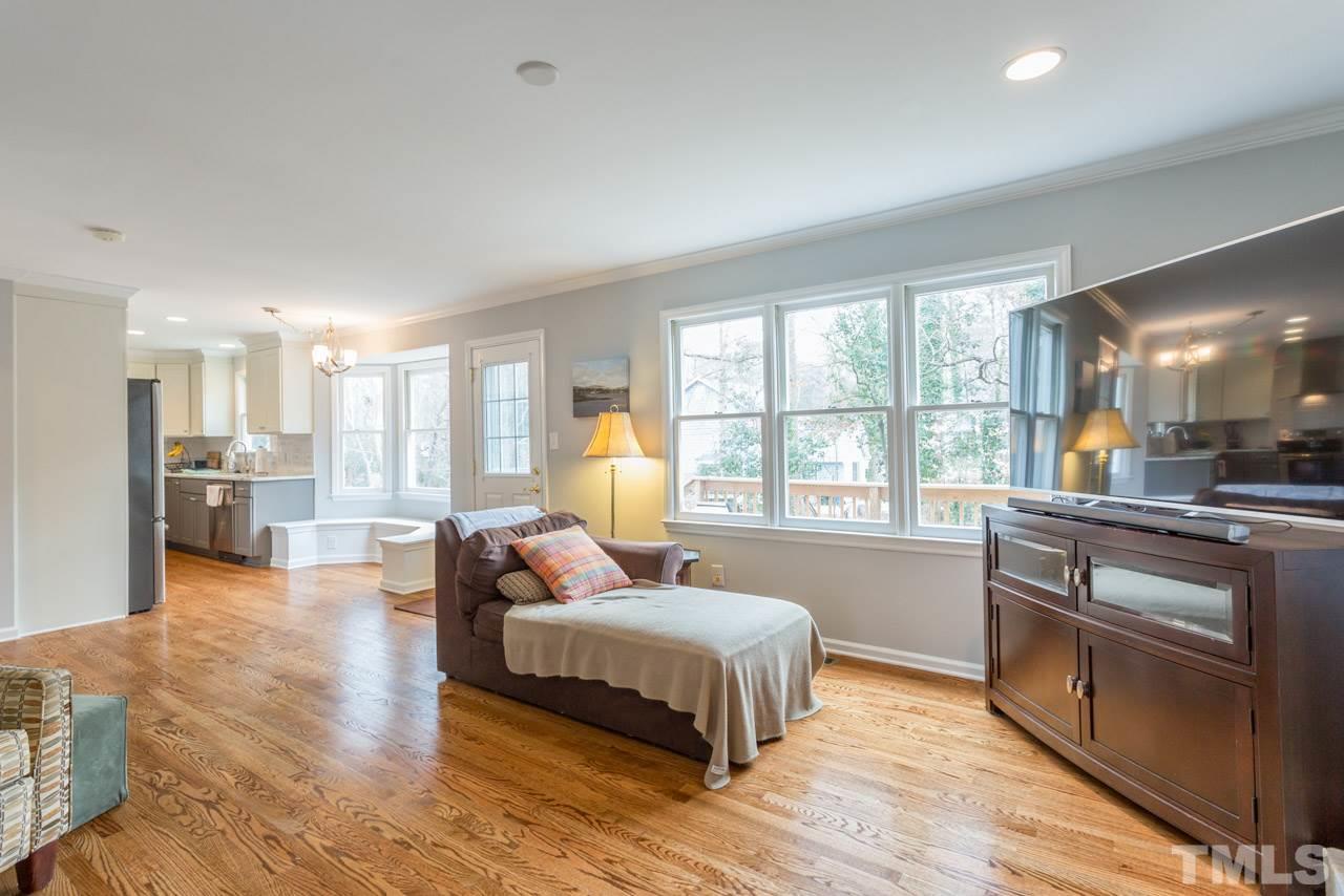 6108 Ivy Ridge Road Raleigh, NC 27612 - Photo 8 of 23 a bedroom with a bed and a large window