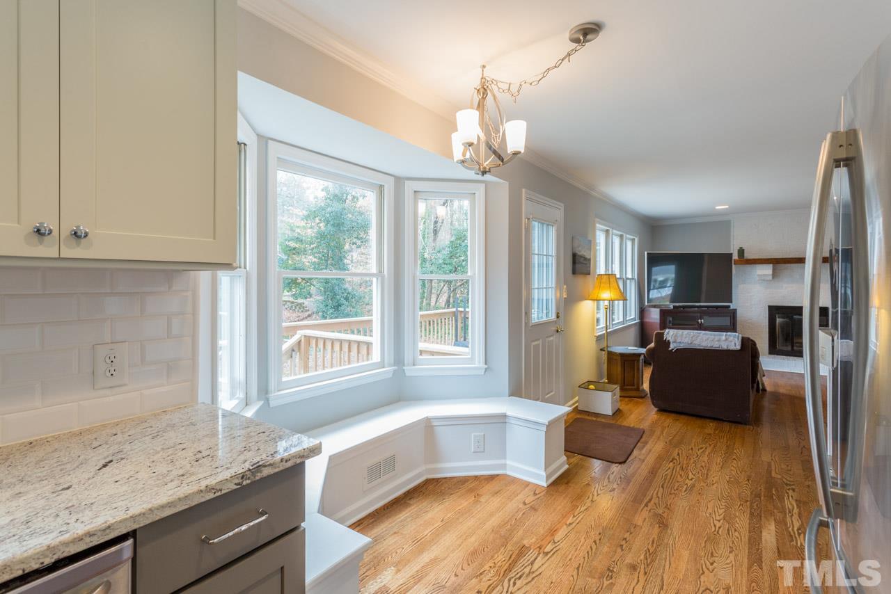 6108 Ivy Ridge Road Raleigh, NC 27612 - Photo 10 of 23 a living room with furniture and a large window