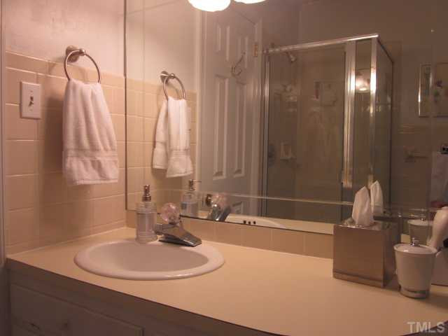 2031 Reaves Drive Raleigh, NC 27608 - Photo 21 of 25 All bedrooms have direct access to a full bathroom! This is a rare find in older homes! Jack & Jill baths have some updates, tile floor and tile shower! Master Bath/Spa