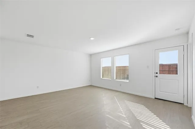 an empty room with windows