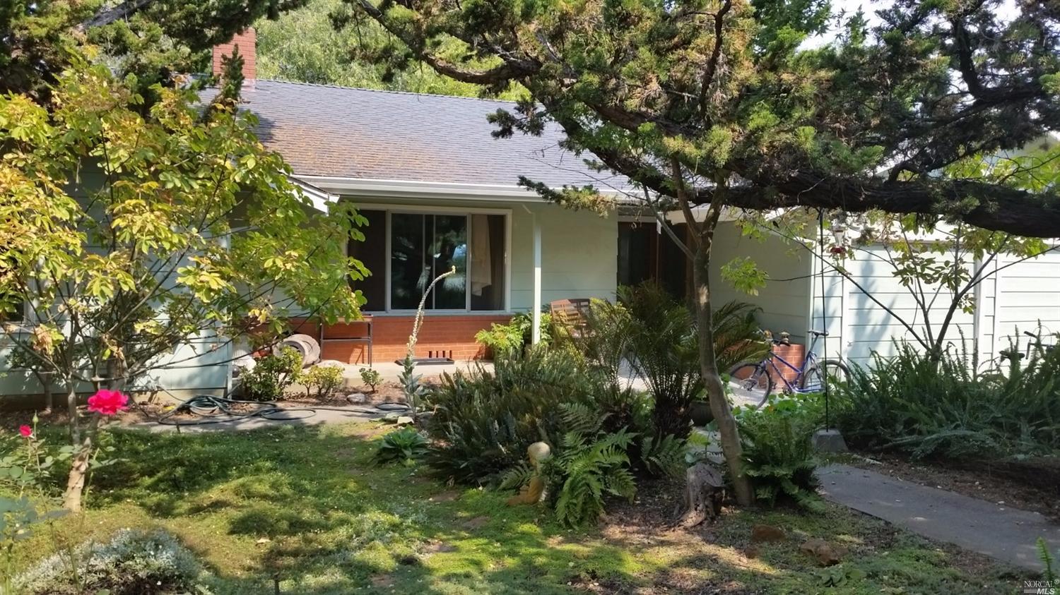 8780 Barnett Valley Road Sebastopol, CA 95472 - Photo 1 of 1 a view of a house with a tree front of house