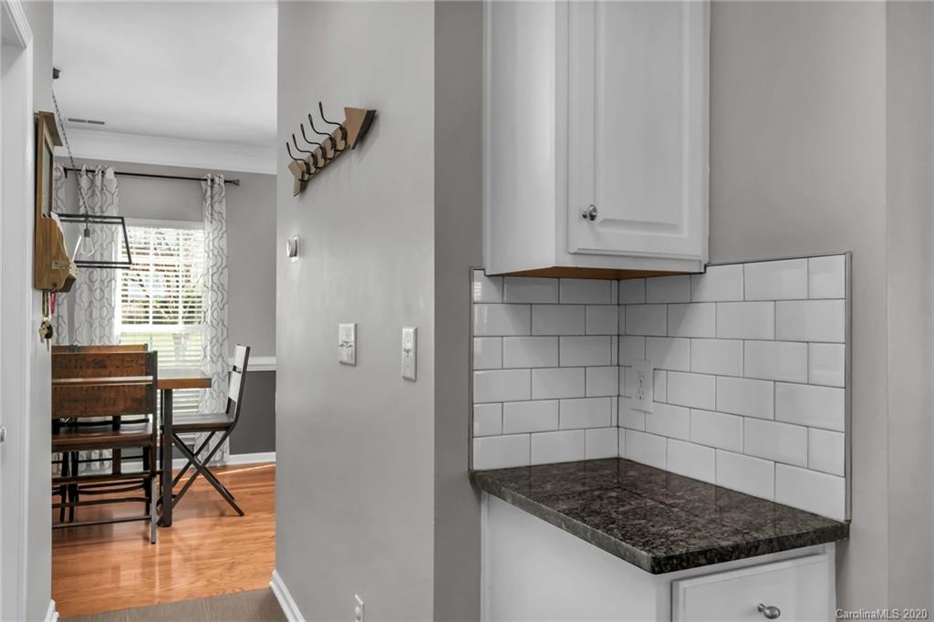 5548 Alexandrite Way, Unit 422 Fort Mill, SC 29708 - Photo 11 of 35 a kitchen with a table and chairs in it