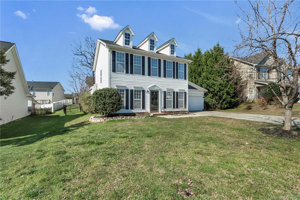 5548 Alexandrite Way, Unit 422 Fort Mill, SC 29708 - Photo 3 of 35 a front view of a house with a yard