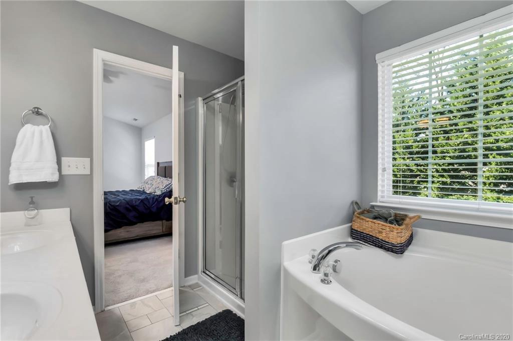 5548 Alexandrite Way, Unit 422 Fort Mill, SC 29708 - Photo 21 of 35 a bedroom with a bed and a window