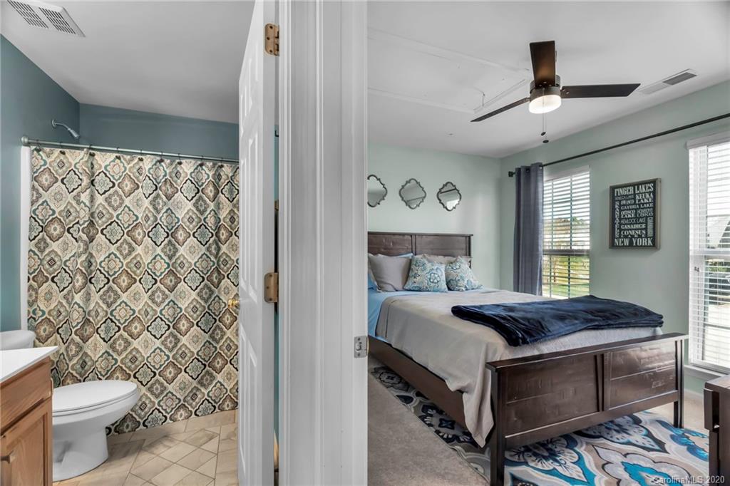 5548 Alexandrite Way, Unit 422 Fort Mill, SC 29708 - Photo 23 of 35 a bedroom with a bed and a window