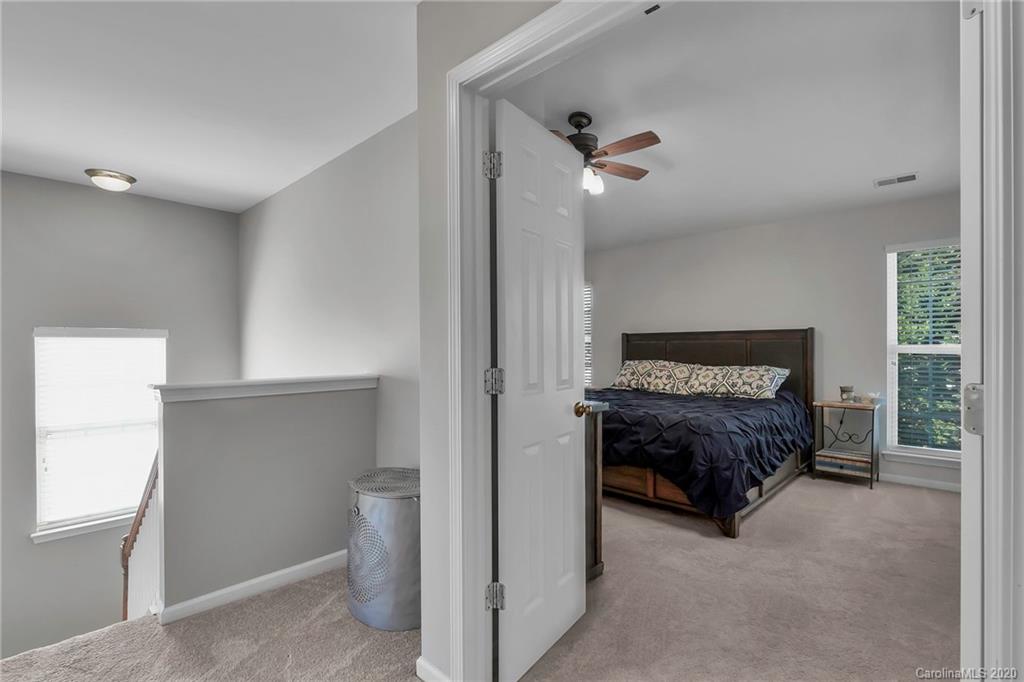 5548 Alexandrite Way, Unit 422 Fort Mill, SC 29708 - Photo 26 of 35 a living room with a bed and a window