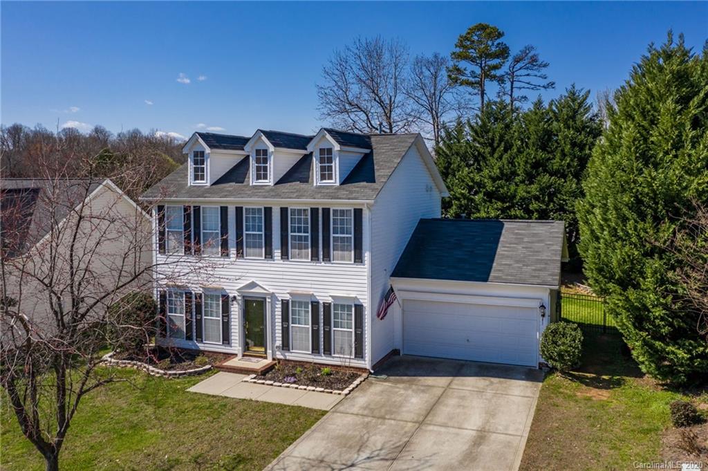 5548 Alexandrite Way, Unit 422 Fort Mill, SC 29708 - Photo 34 of 35 a front view of a house with a yard