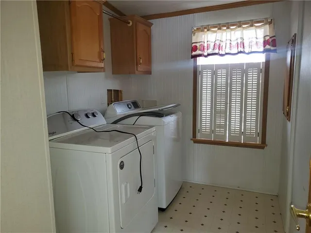a utility room with closet dryer and washer