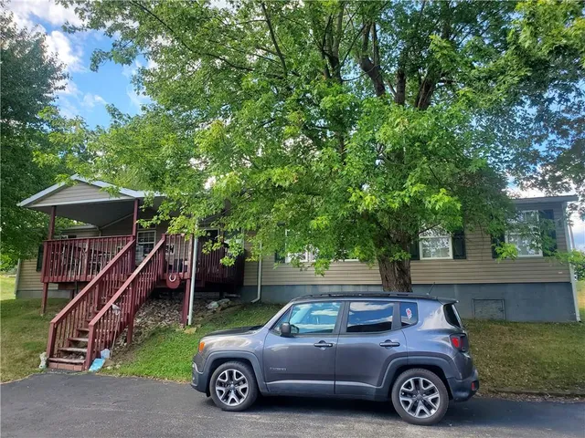 a car parked in front of a house
