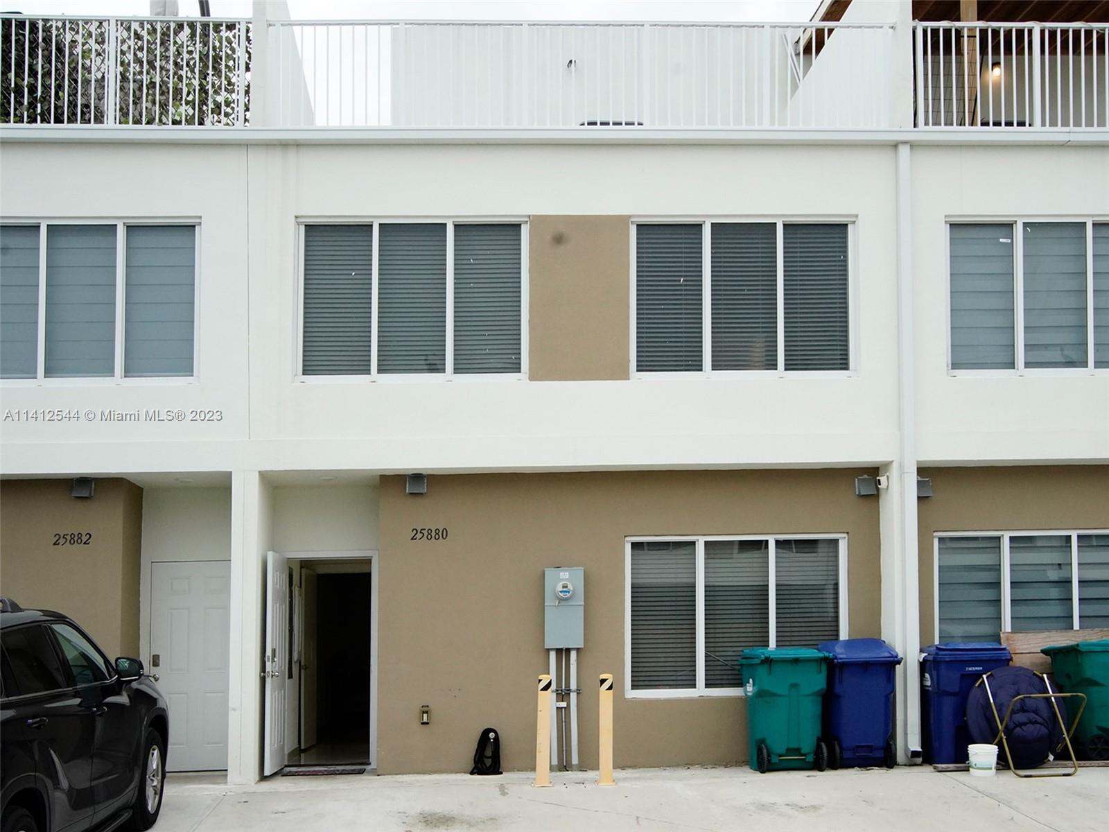 Naranja Homestead, FL 33033 - Photo 19 of 22 a view of a building with a window and a view of windows