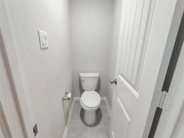 an empty room with windows and mirror fan