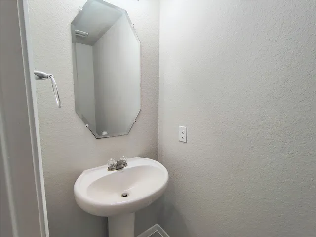 a bathroom with a toilet and a sink