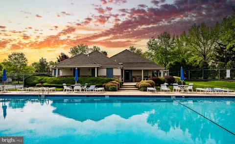 a front view of house with yard and outdoor seating
