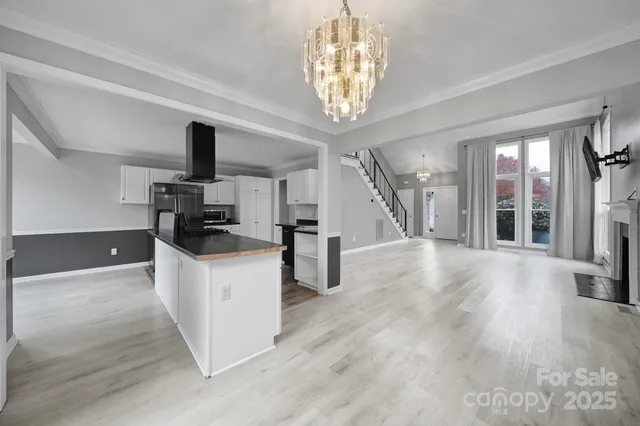 a kitchen with stainless steel appliances a stove top oven and cabinets