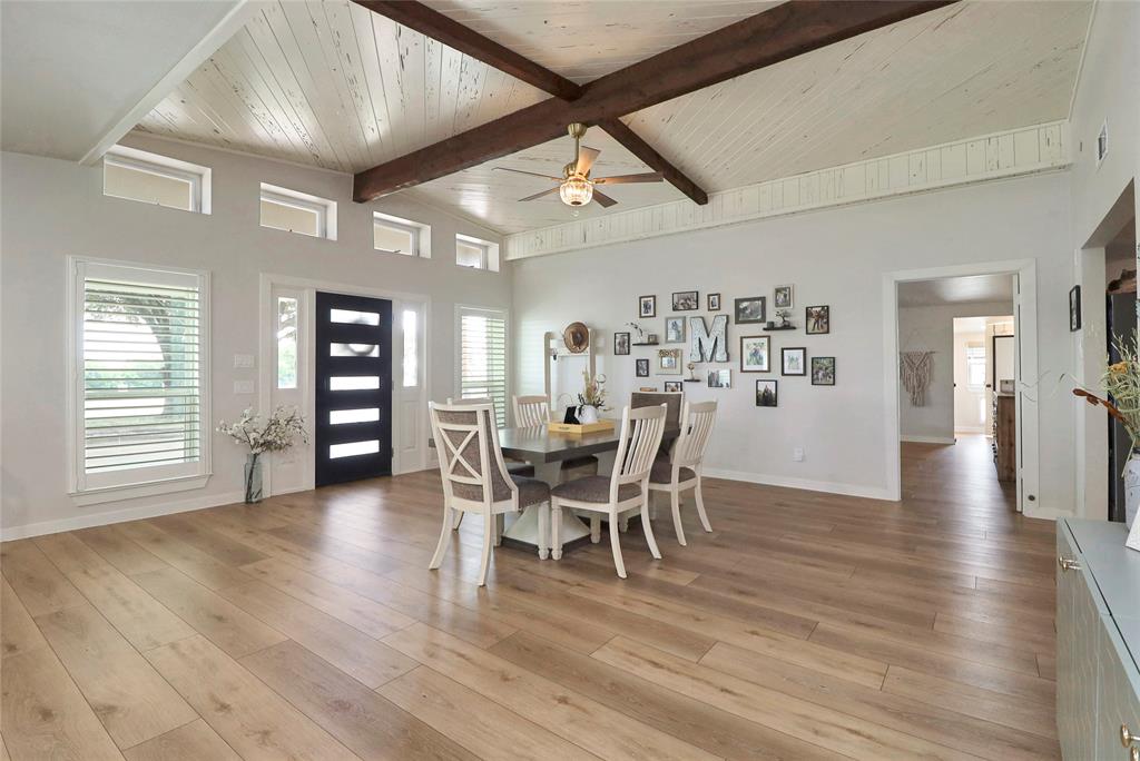 2408 Strader Road DISH, TX 76247 - Photo 6 of 40 a dining room with furniture wooden floor a chandelier and a painting