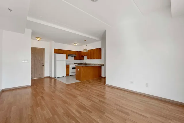 a view of kitchen with wooden floor