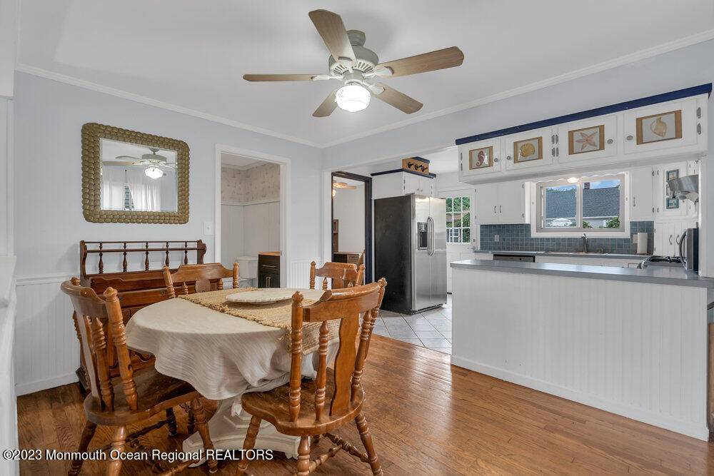 1421 Thomas Street Point Pleasant, NJ 08742 - Photo 12 of 20 a view of a dining room with furniture and a kitchen view