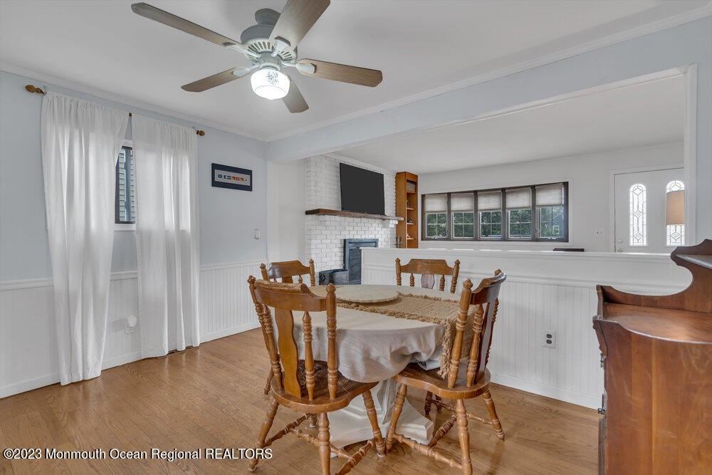1421 Thomas Street Point Pleasant, NJ 08742 - Photo 13 of 20 a view of a dining room with furniture and a chandelier fan
