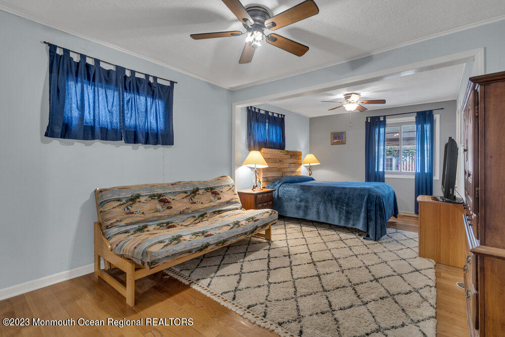 1421 Thomas Street Point Pleasant, NJ 08742 - Photo 14 of 20 a bedroom with furniture and window