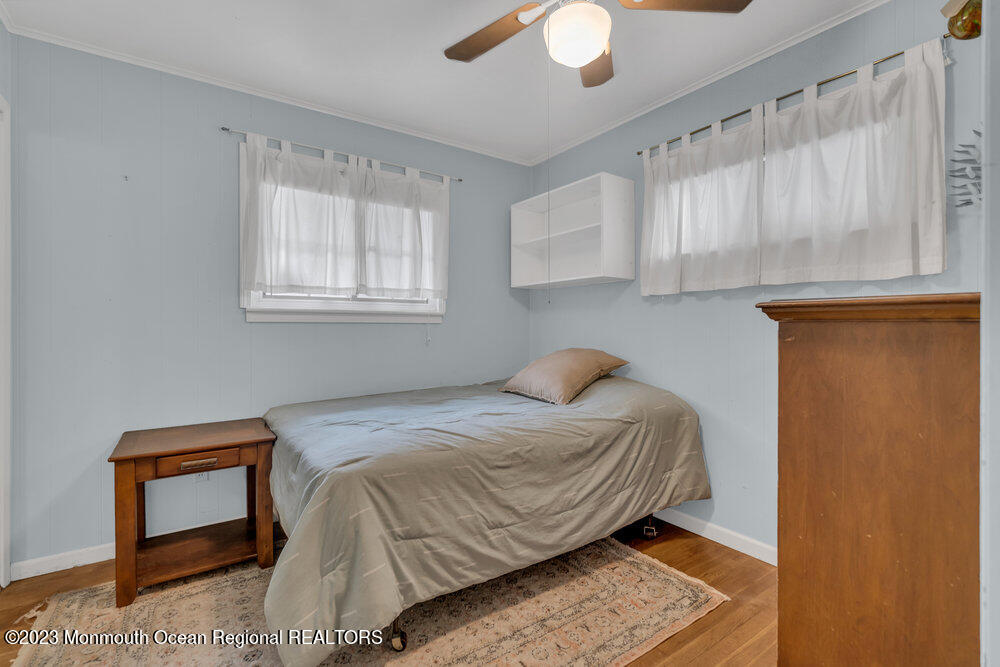 1421 Thomas Street Point Pleasant, NJ 08742 - Photo 15 of 20 a bedroom with a bed and a window
