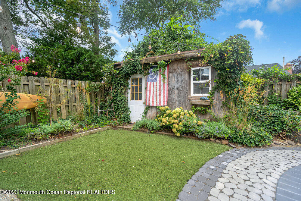 1421 Thomas Street Point Pleasant, NJ 08742 - Photo 20 of 20 a front view of a house with garden