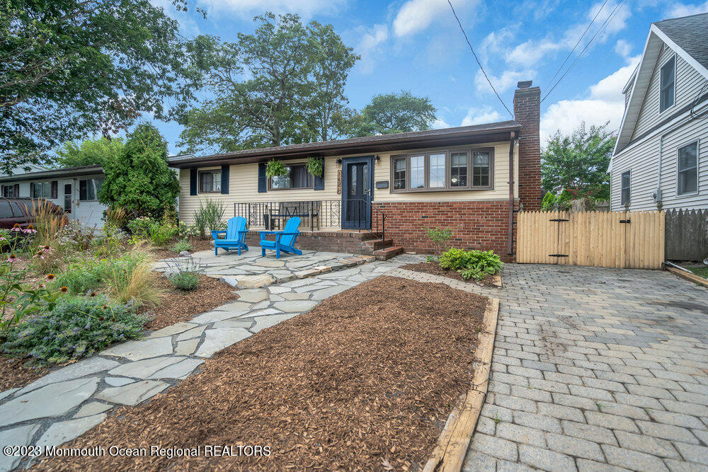 1421 Thomas Street Point Pleasant, NJ 08742 - Photo 2 of 20 a front view of a house with garden