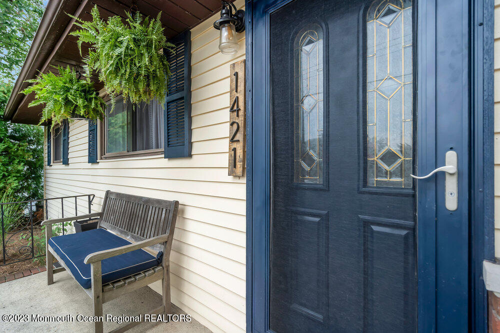 1421 Thomas Street Point Pleasant, NJ 08742 - Photo 4 of 20 a view of a wooden bench sitting in front of a door