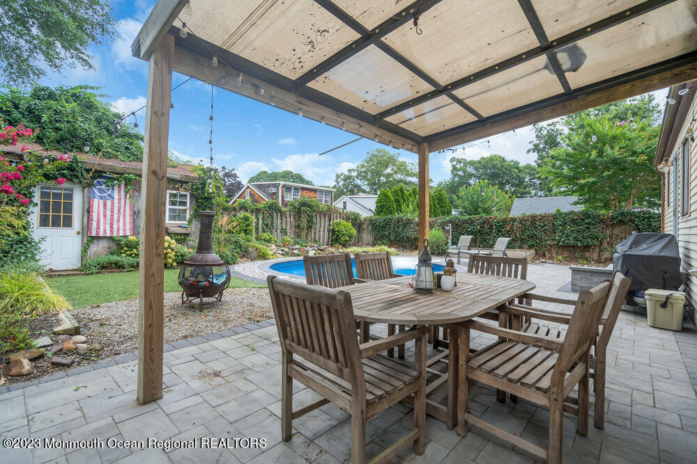 1421 Thomas Street Point Pleasant, NJ 08742 - Photo 7 of 20 a view of a patio with a table chairs and a backyard