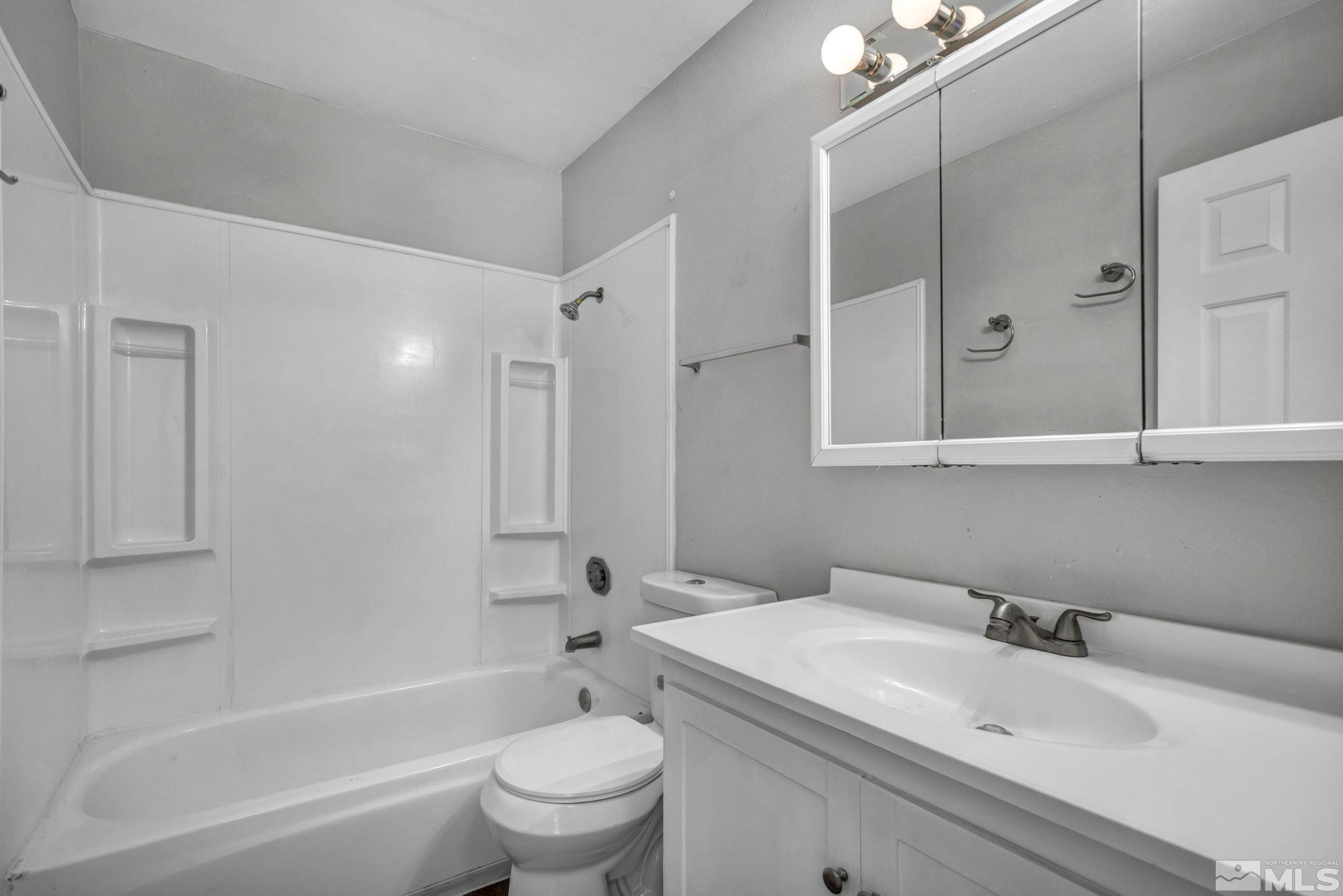 6550 Fern Street Reno, NV 89506 - Photo 13 of 19 a bathroom with a sink toilet and shower