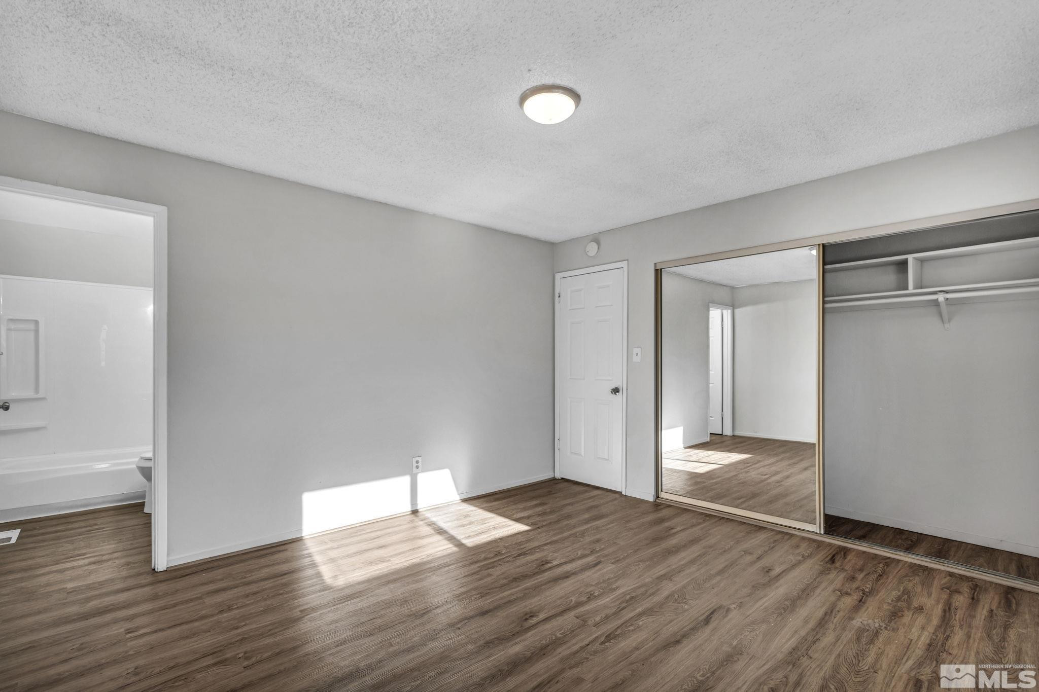 6550 Fern Street Reno, NV 89506 - Photo 8 of 19 a view of empty room with wooden floor