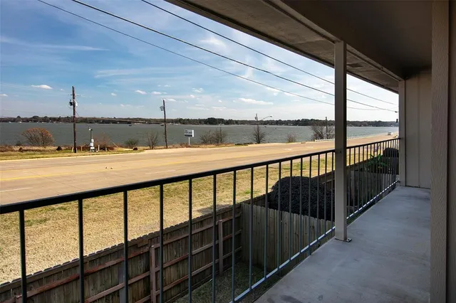 a balcony with furniture and city view