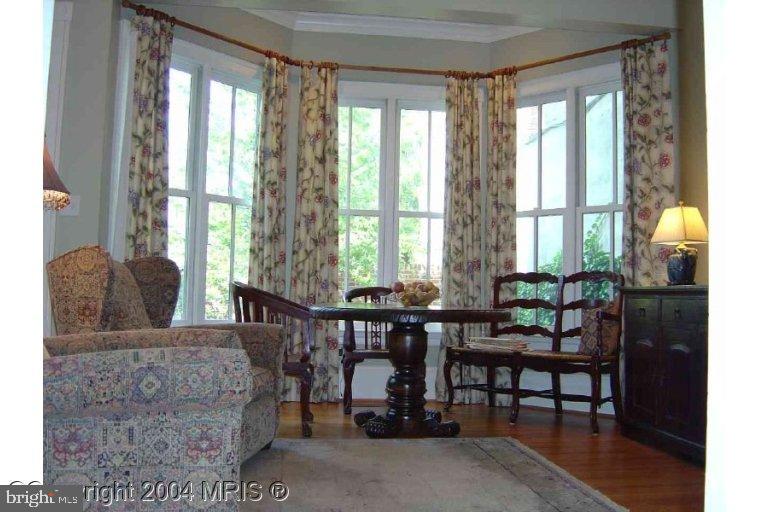 16 7th Street Northeast Washington, DC 20002 - Photo 5 of 15 a living room with furniture and floor to ceiling windows