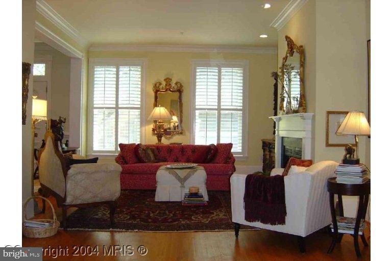 16 7th Street Northeast Washington, DC 20002 - Photo 7 of 15 a living room with fireplace furniture and a large window