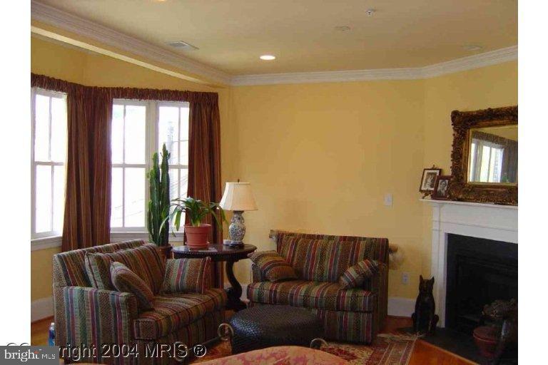 16 7th Street Northeast Washington, DC 20002 - Photo 10 of 15 a living room with furniture and a fireplace